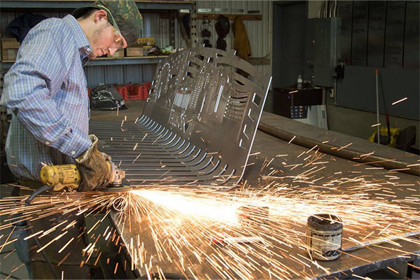 Welding a steel memorial bench at Smith Steelworks